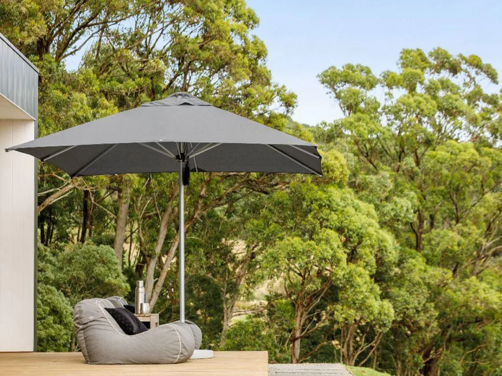 grey centre post parasol on garden decking