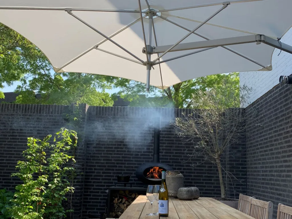 wall mounted parasol providing shade in courtyard garden setting