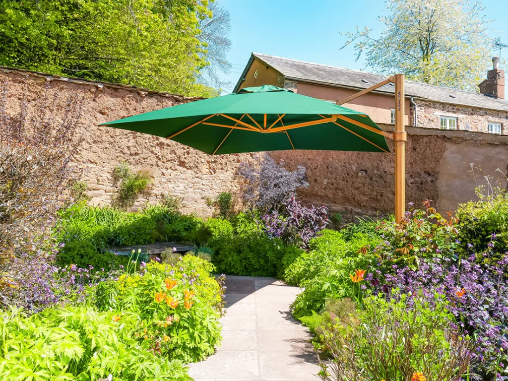 instashade cantilever parasol with a unique wood effect frame finish in lush garden