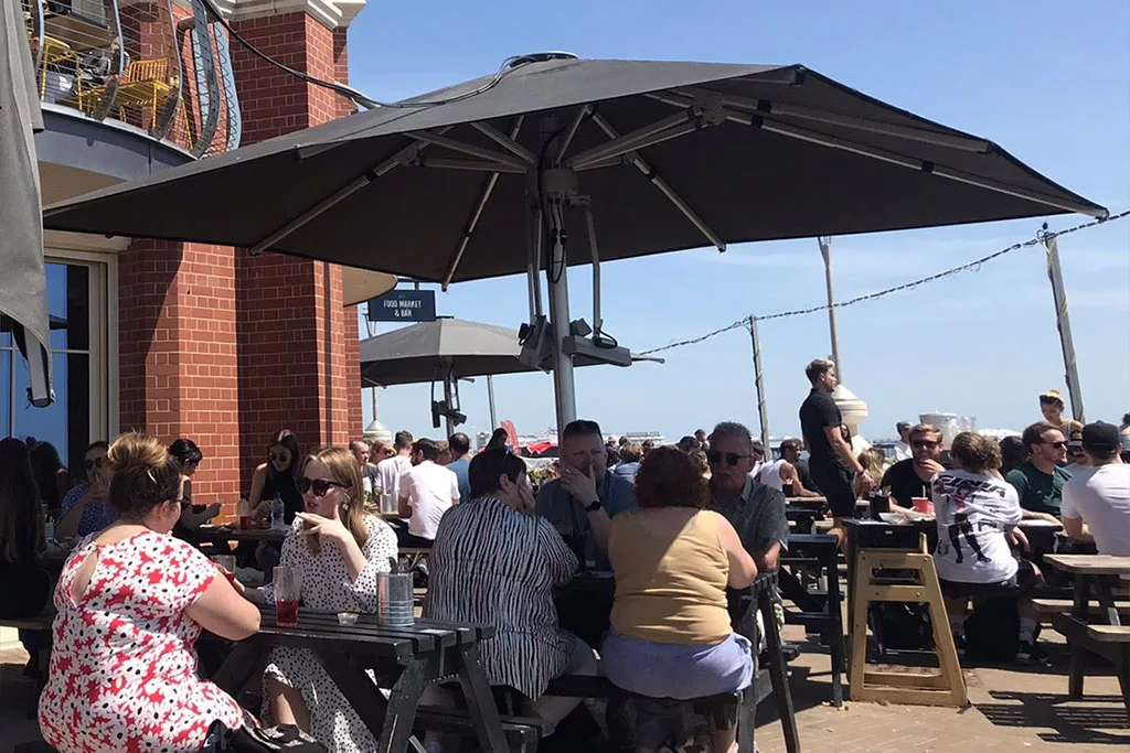 Marine grade Instashade commercial parasols installed on the seafront at Shelter Hall Brighton.