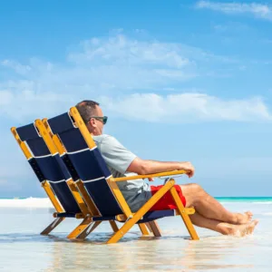 Oakwood-Deck-Chair-Man-Sat-On-The-Beach Oakwood Premium Deckchair