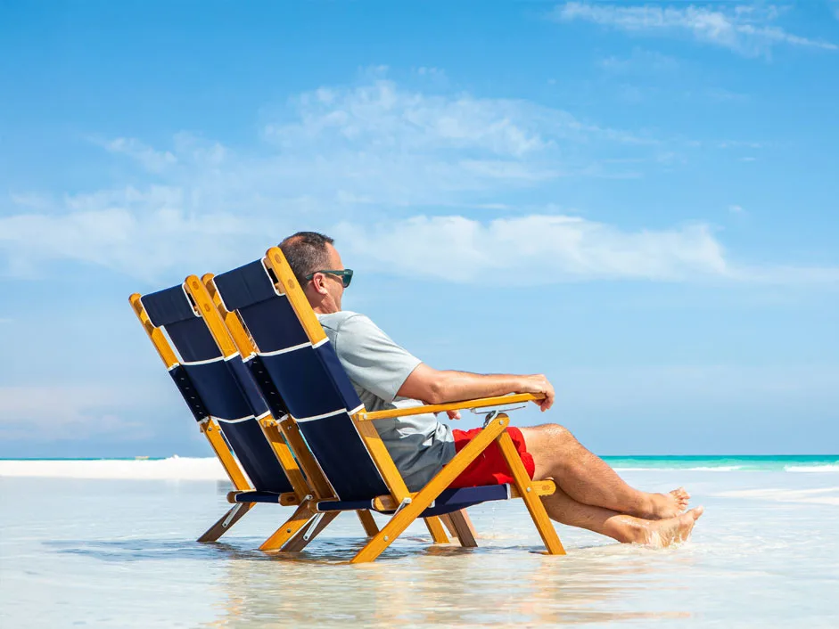 Oakwood-Deck-Chair-Man-Sat-On-The-Beach Oakwood Premium Deckchair